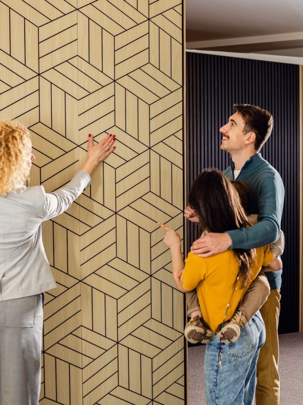 saleswoman-showing-a-young-couple-with-a-child-the-2026-01-11-08-55-54-utc